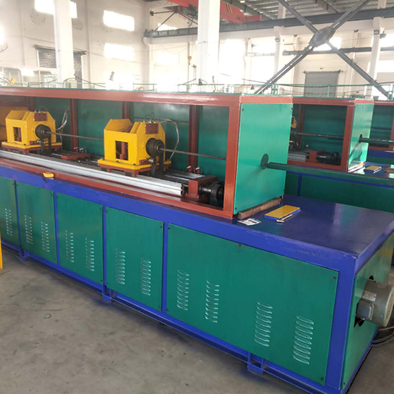 Industrial spiral fin tube machine producing continuous helical fins onto base tubes for heat exchanger applications